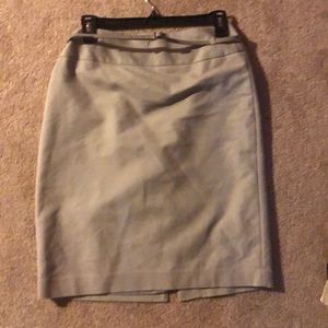 A grayish beige skirt